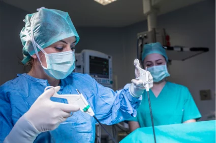 Two surgeons performing surgery in an operating room