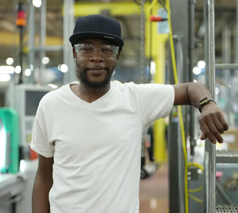 A man in a white shirt and a black hat