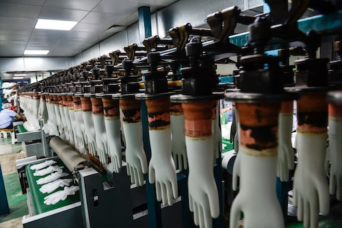 A room filled with lots of white and brown gloves